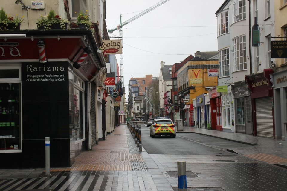 Empty Oliver Plunkett Street with Gardai